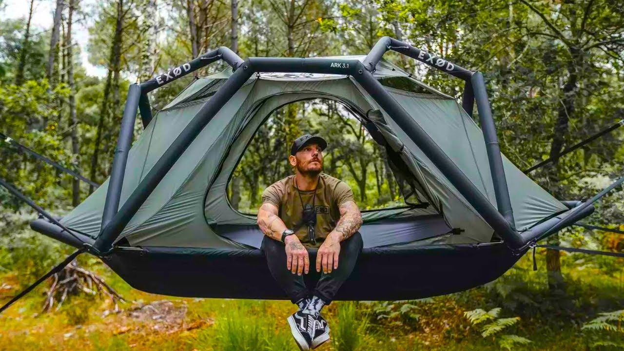 man in a tree tent